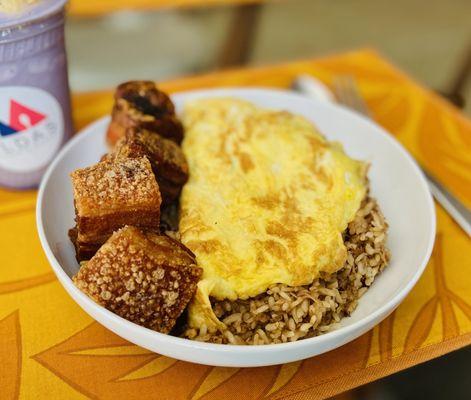 Adobo Omelet Fried Rice with a side of Lechon. Those Lechon pieces are huge!