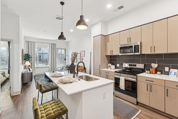 Modern kitchen with sleek countertops and stainless steel appliances