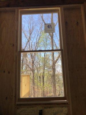 Window framed (and insulated in, but not leveled. Does not close securely/completely.