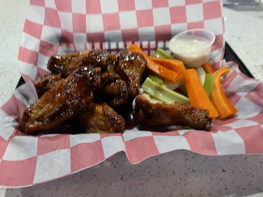 Chicken wangs w/bourbon sauce + celery, carrot sticks + ranch dressing