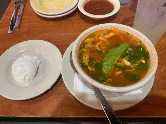 Tortilla soup with sour cream