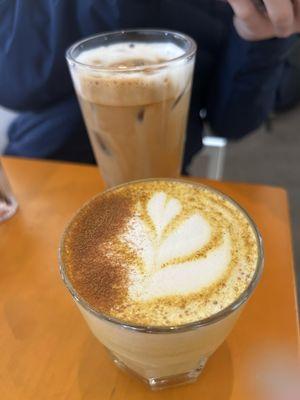 "Sun Salutation" (turmeric golden milk latte) and regular latte in the background)