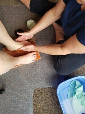 Jane salting me feet while they sit on a salt block!