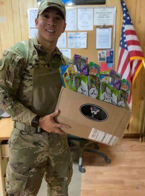 Deployed Service member excited to receive treats from home.