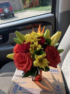 The bride's bouquet with roses, tiger lilies, and the must have: birds of paradise peeking in from the back!