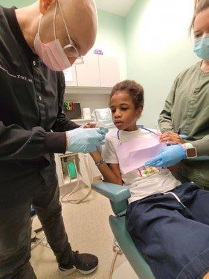 Dr Z. Working his magic! THE BEST PEDIATRIC DENTIST IN ATLANTA! wonderful and patient with autistic kids