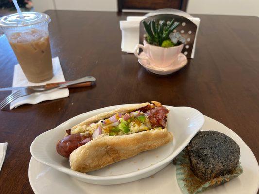 Loaded hot dog with a chai tea and corn bread