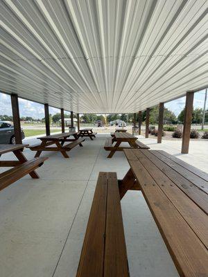 Looking out from the picnic tables towards the pickle ball courts and playground.