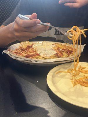 Manicotti over spaghetti