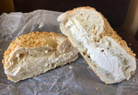 Plain cream cheese on a garlic bagel