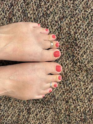 My feet's with coral painted toes