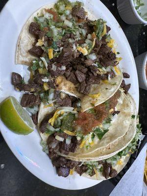 3 steak tacos. I added cheese for mine for $1.25 as it does not come with. Still part of our $40 bill for all. The steak was juicy.