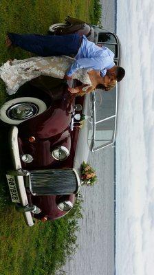 Her white gown is beautifully showcased with classic Rolls-Royce color