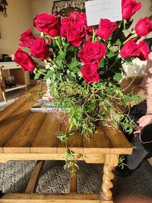 Another photo of 3 dozen red roses with vines around the base. So creative and beautiful!