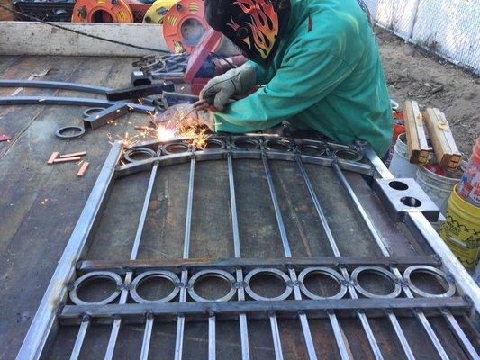 Welding together a custom made wrought iron gate at our shop. Mike there has been welding for 50 years.