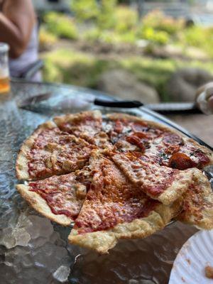 The BEST Pizza in upstate NY! Not joking. Sit outside Cates. You will not be disappointing. Thin crust, and crispy! Loved it