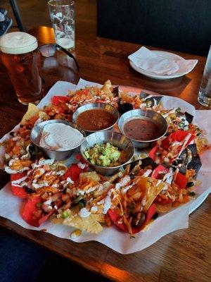 Chicken nachos with sour cream and guacamole. Absolutely amazing