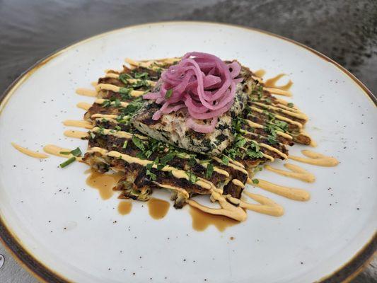 Grilled Mahi- Okonomiyaki (Cabbage Pancake), Bacon, Carrots, Sesame Oil, Sriracha Aioli, Soy Reduction, Pickled Red Onions, Cilantro