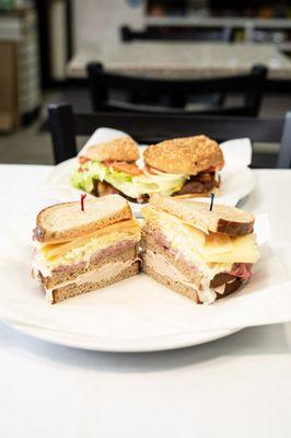 Turkey, roast beef and Swiss cheese served with coleslaw and Russian dressing on three layers of Rye bread.