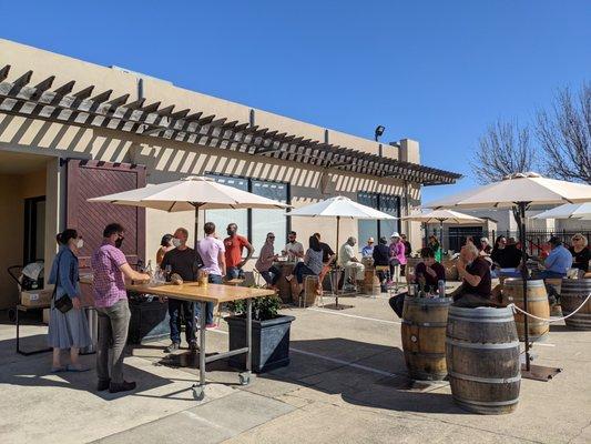 Outdoor wine tastings, with sun umbrellas for each table.