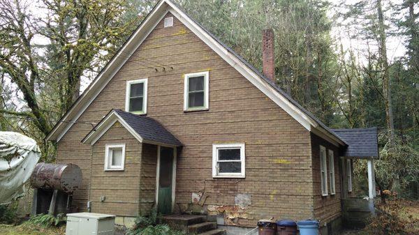 Siding before side view house #1