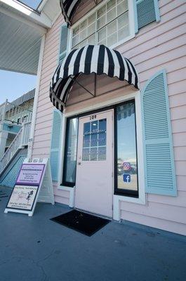 Front of Keywest Plaza, next to staircase. Koala Bare front door.