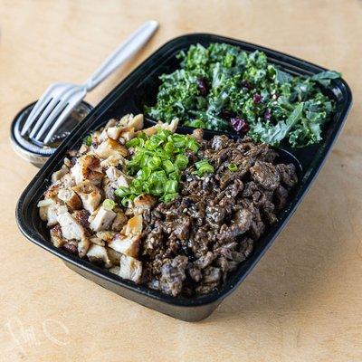 Combo bowl with beef, chicken and kale salad.