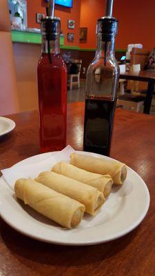 A2. Thai Crispy Spring Roll $3.70 Bottles of sweet and sour sauce and soy sauce.