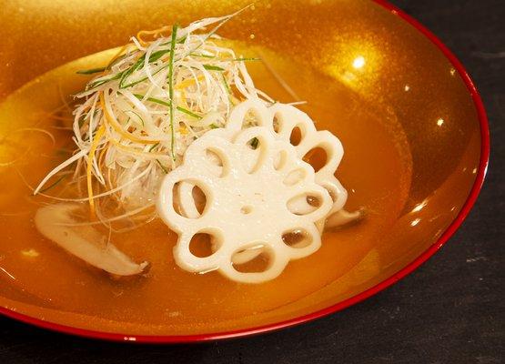 Tsumire - the first appetizer on a course menu. Fluffy fishball mixed with Japanese herb with dashi broth.