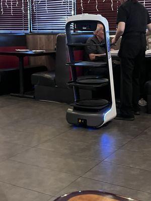 Robot delivering food to assist Waitress