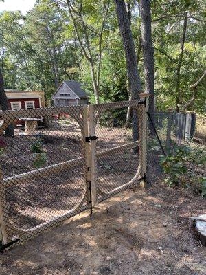 Cedar framed chain link fence.