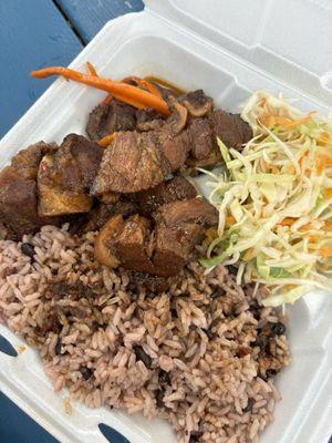 stew pork over rice & peas with cabbage