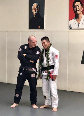 Master Crane talking story with his new Professor Tim after black belt ceremony.