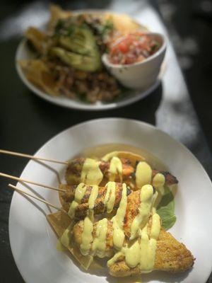 Chicken skewers with a curry sauce