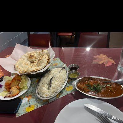 Chicken vindaloo, naan and puri bread