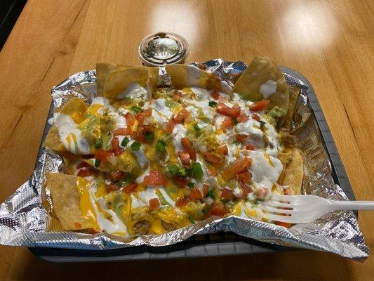 Half order of chicken nachos...get in my belly!