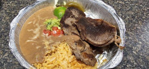 Chile Rellenos with Spanish rice and refried beans.