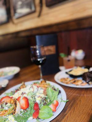 Strawberry chicken salad, ribs and shrimp with macaroni and cheese, Caesar salad