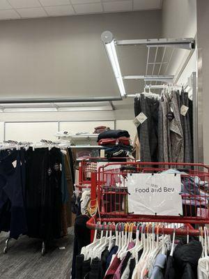 Return to shelves baskets stashed against racks in dark and hidden. Plus Size section