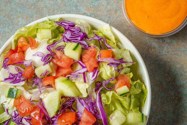 Lettuce Mix, Tomatoes, Cucumbers, and Red Cabbage. And Your Choice of Dressing.