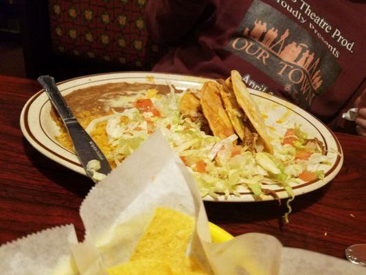 Tacos with rice and beans (he forgot to ask for no veggies so they are out of the taco)