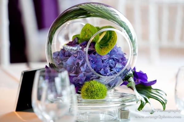 Glass orb centerpiece with anthurium and hydrangeas