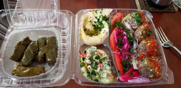 Falafel bowl and grape leaves.