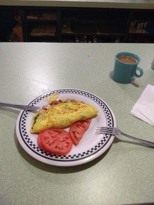 I ordered a western omelette tomato and coffee for breakfast.