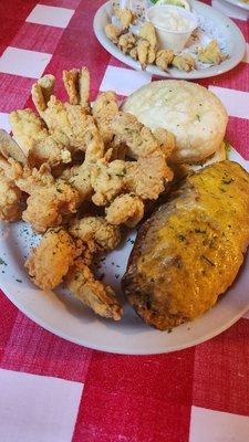 Fried shrimp dinner and half eaten fried crab claws