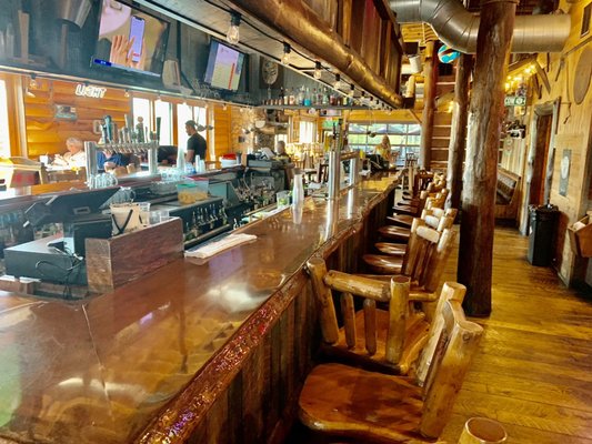 Large Bar with all Wooden Tables and Chairs