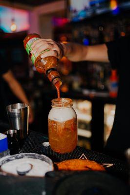 Michelada- clamato, beer, tabasco, tajin, chamoy, valentina