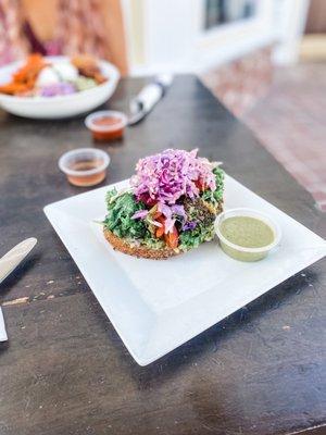 Avocado toast with kale , slaw and cherry tomatoes