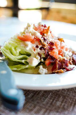 Classic Wedge Salad with your choice of house-made bleu cheese dressing or Chipotle Ranch. Served as a substitution side or an added salad.