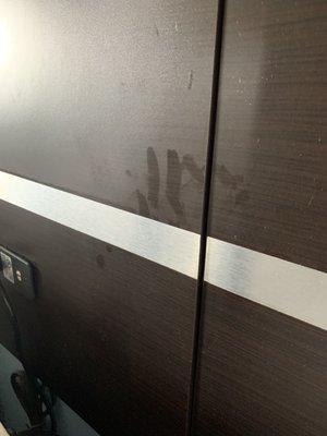 Hand prints in dust on headboard?